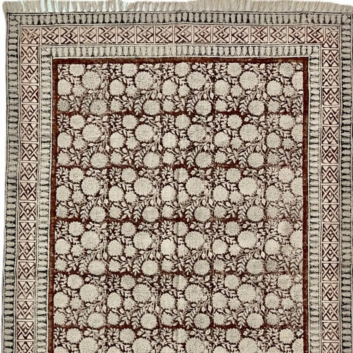 Shop handmade Indian cotton rugs crafted by skilled artisans. Boho, modern & durable area rugs for living rooms and bedrooms.