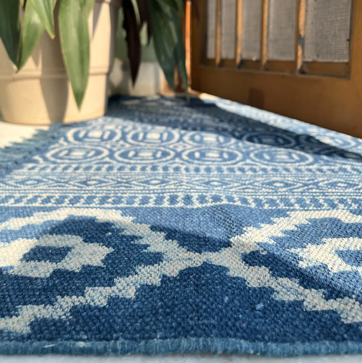 Handcrafted Indian cotton rugs with timeless design. Shop boho area rugs for living room, bedroom & home décor.