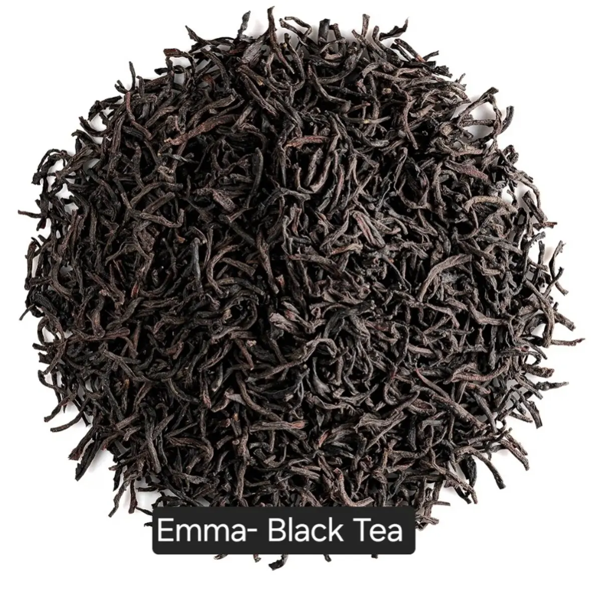 A close-up overhead view of premium loose-leaf black tea leaves displayed in a circular mound against a white background. The leaves are deep dark brown to black in color, twisted and whole, indicating high-quality, small-batch artisan-curated black tea. Color: Deep Black Brown