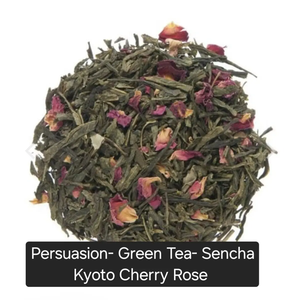 A close-up mound of handcrafted Sencha Kyoto Cherry Rose loose leaf green tea, showing long dark green tea leaves interspersed with vibrant dried pink and red rose petals and small dried cherry pieces. The blend has a rich, textured appearance with earthy greens, deep pinks, and warm amber tones. Color: Green, Pink, Red