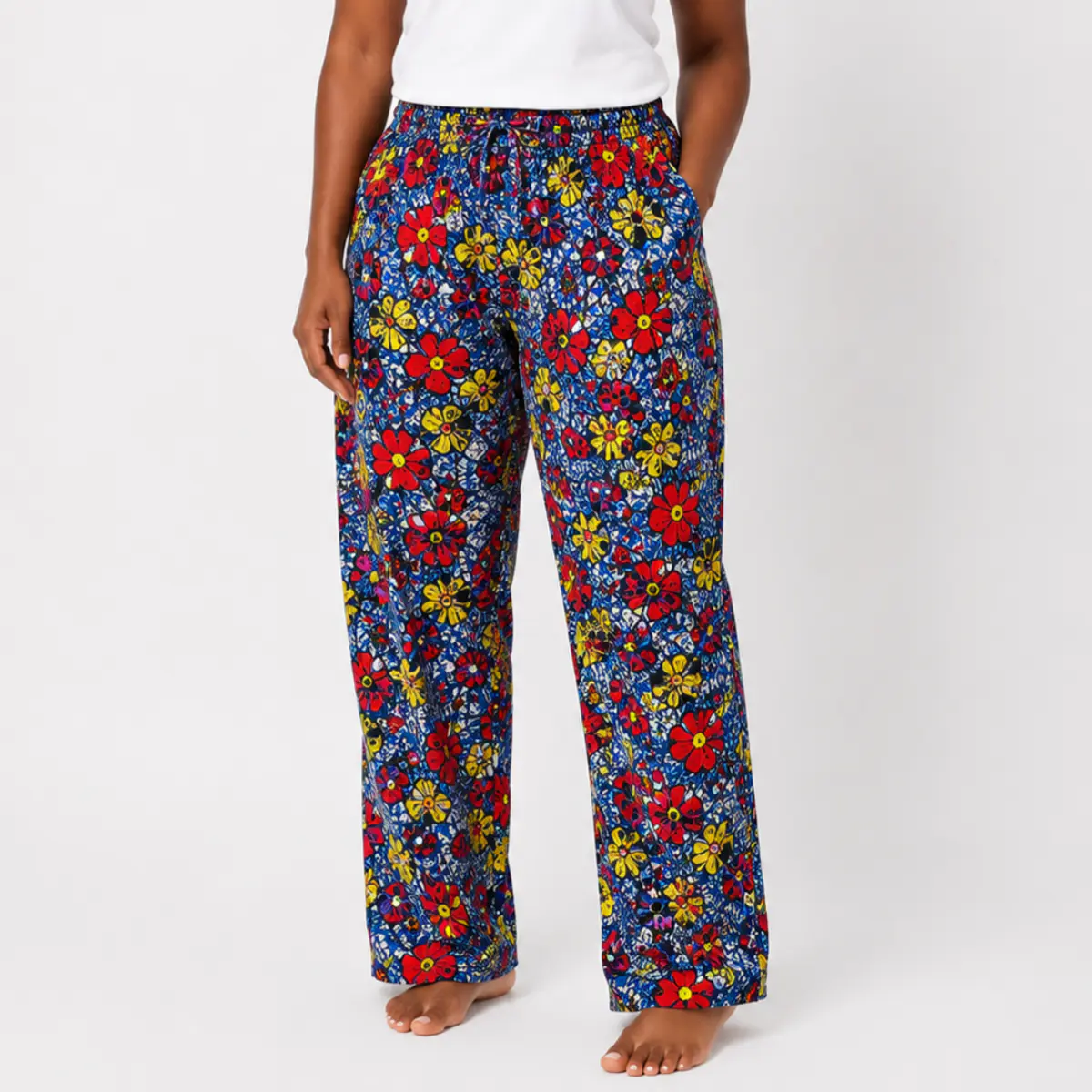 Handcrafted Ankara floral trousers front view. Color: Blue, Red, Yellow